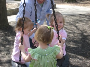 Lydia all smiles on the tire swing Lydia all smiles on the tire swing