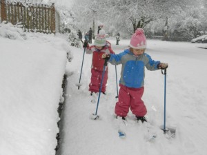 Hadley and Lydia making fresh tracks on our street