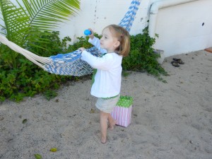 Hadley finding an easter egg the Easter bunny hid in the hammock